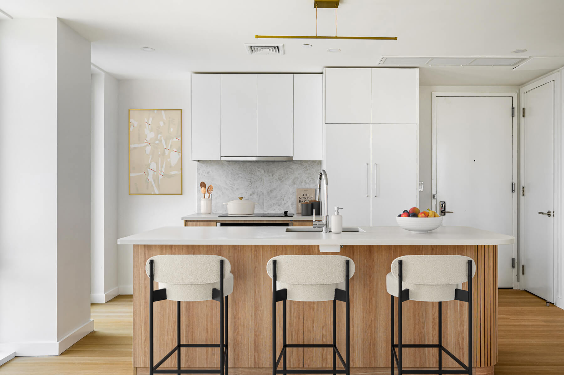 Modern kitchen with Caesarstone countertops in Prosper apartments